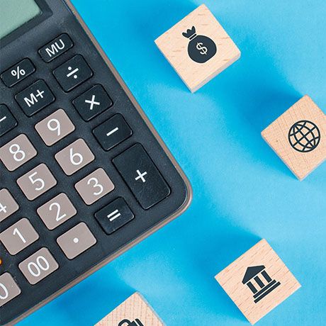 Calculator with wood chips on the side.